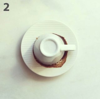 Flip it towards your way, in order to leave coffee marks in the cup