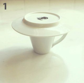 Cover the cup with the saucer